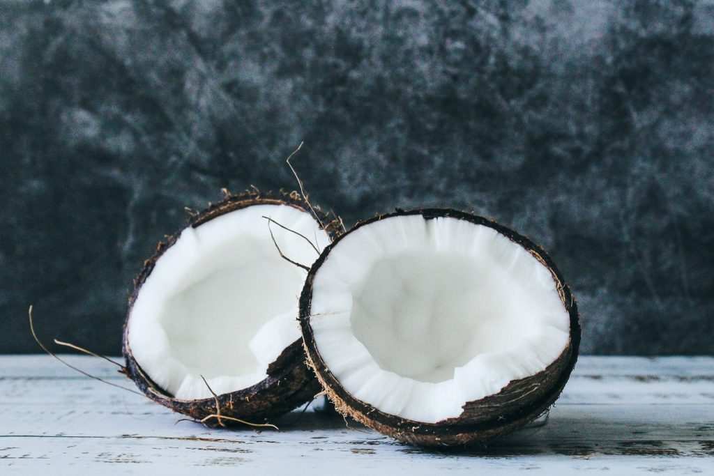 A coconut broken in half.